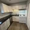 Renovated kitchen w/ granite countertops subway tile back splash