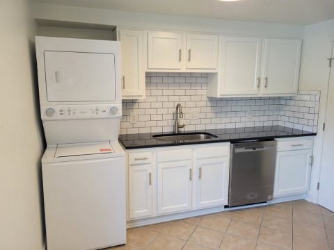 Renovated kitchen with Subway tile back splash & granite countertops