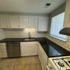 Renovated kitchen with Subway tile back splash & granite countertops