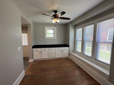 Dining room w/ additional bar cabinets and granite countertops