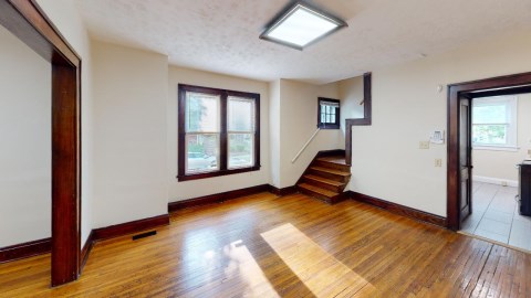 Dining Room with Gorgeous Lighting and Hardwood Floors!