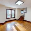 Dining Room with Gorgeous Lighting and Hardwood Floors!