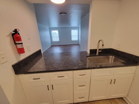 Living room opens from kitchen bar