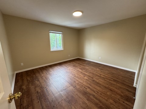 Bedroom w/ new LVT flooring
