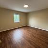 Bedroom w/ new LVT flooring