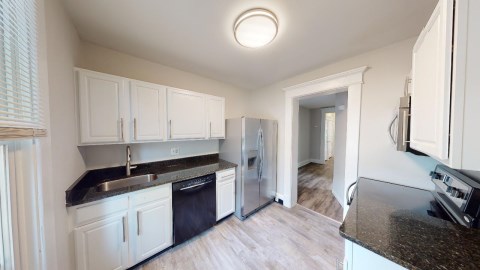 This full size kitchen has updated cabinets, brand new granite countertops and a new kitchen sink!