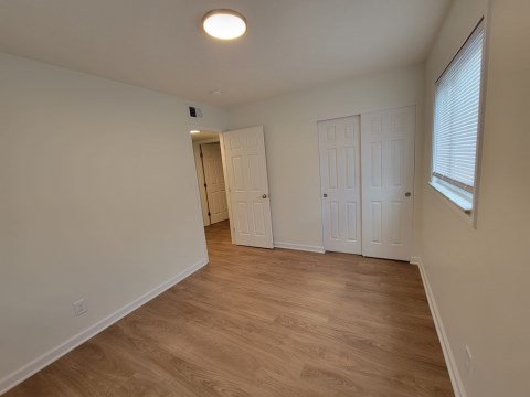 Bedroom w/ new windows and new flooring