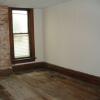 Middle bedroom with brick chimney accent