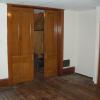 Front bedroom with original hardwood pocket doors