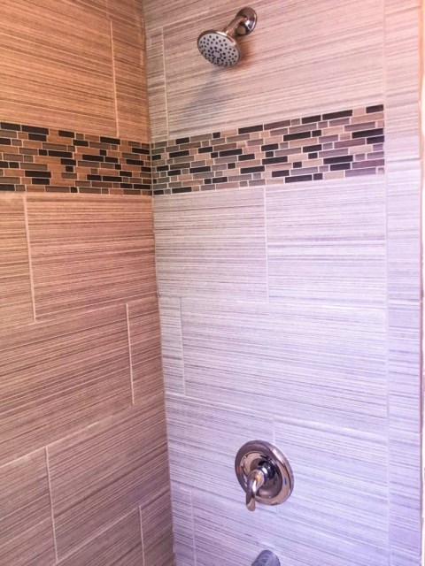 Shower is updated with porcelain tile!
