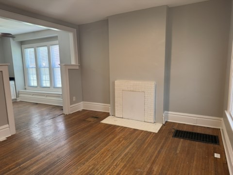 Living room w/ decorative fireplace