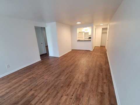 Living room opens to Kitchen