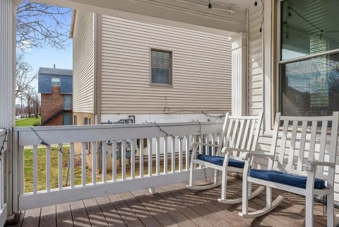 Beautiful private front porch!  Also tons of parking out back!  One spot for each person!