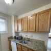 Kitchen with brand new full sized Stainless Steel Refrigerator, dishwasher, oven, granite countertops