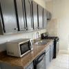 Full sized kitchen including Microwave, Dishwasher, Oven/Cooktop, Disposal, Lots of Shelving