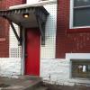 Building side entrance to Pearl Alley facing Starbucks