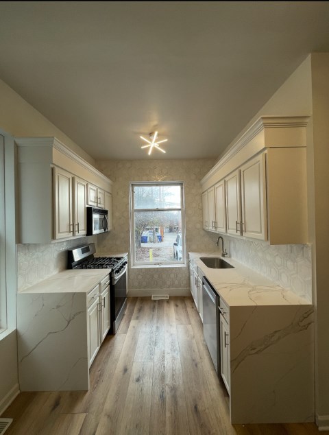 NEWLY RENOVATED WITH LUXURY QUARTZ COUNTERTOPS & MARBLE BACKSPLASH!!! WOW!