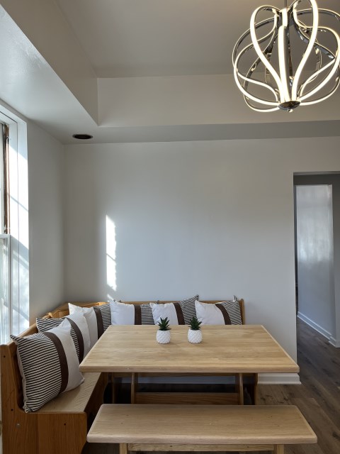 Table and bench seating with pillows-Comes with house!
