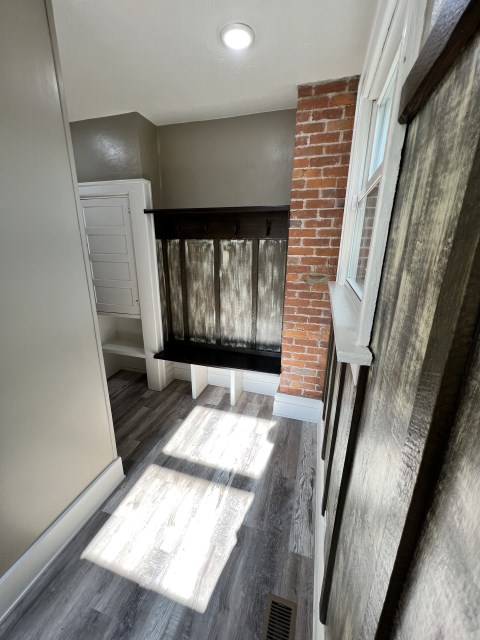 Mudroom with coat hooks and cubbies