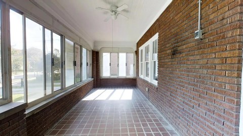 The front of the home features a private screened-in porch!
