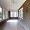 The front of the home features a private screened-in porch!
