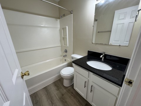 Renovated bathroom w/ new bathtub, surround and vanity with granite countertopsoooom
