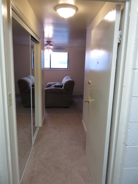 Entryway with closet on one side and bathroom on the other.