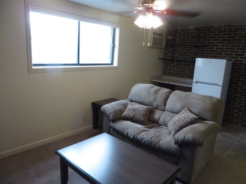 Couch coffee table and two end tables included window, fridge desk and A/C unit. |desc: Window slides left and right instead of up and down. Screen and blinds included. Fridge and freezer. Desk with two shelves. A/C unit is through wall. Electric heater is