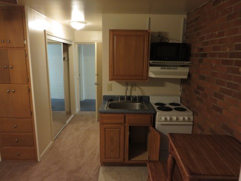 Kitchen and view of hallway.